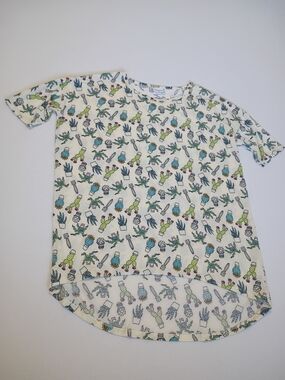 Lularoe Irma tunic top features a whimsical cactus print On Cream Size M